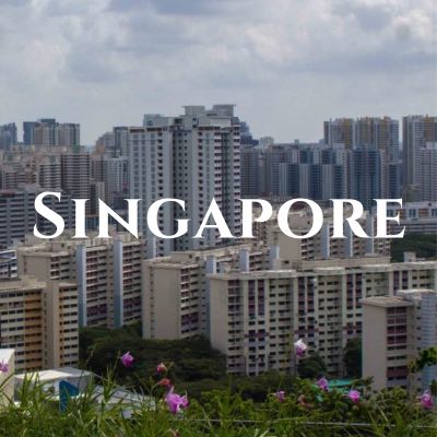 "Singapore" written across a photo of dense skyscrapers.