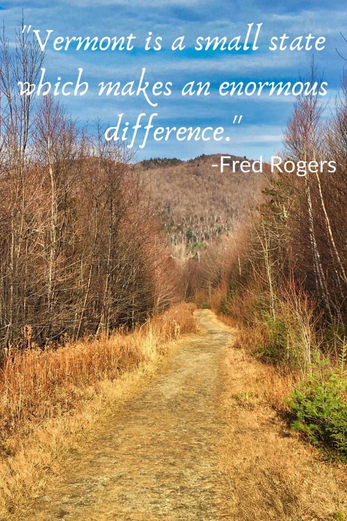 Tree-lined path to a hill, behind the quote, "Vermont is a small state which makes an enormous difference. -Fred Rogers."