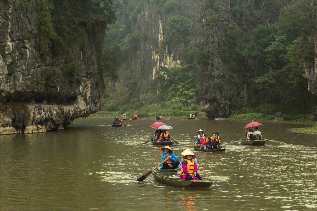 The area around Ninh Binh and Tam Coc in northern Vietnam is often called “Halong Bay on Land,” and the breathtaking scenery is perfect for boat trips and bike rides. Many tourists visit these towns on a quick day trip from Hanoi, but it’s well worth sticking around a bit longer.