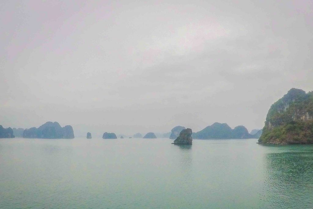 A Halong Bay cruise is the top thing to do in Vietnam - but the bay has become overcrowded, heavily polluted, and unsustainable. For a more ethical trip, look for a Halong Bay alternative like neighboring Bai Tu Long Bay, Vietnam, instead. Here’s what to consider about Bai Tu Long Bay or Halong Bay, plus a guide to planning your trip. #Vietnam #HalongBay #BaiTuLongBay